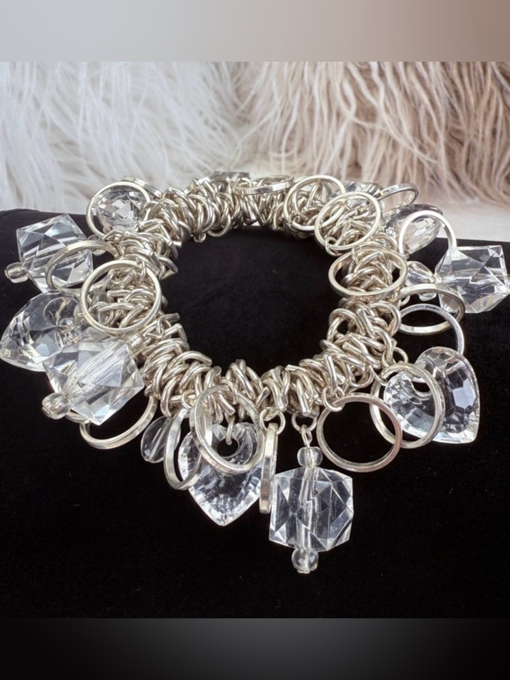 Beautiful Silvertone, and clear, reflective charmed, stretch costume bracelet
